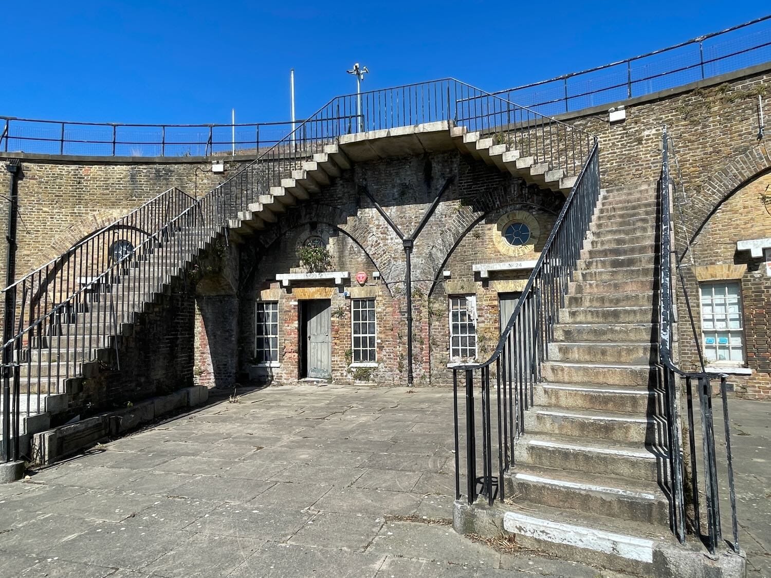 Twin staircases to the parade ground from an upper platform area